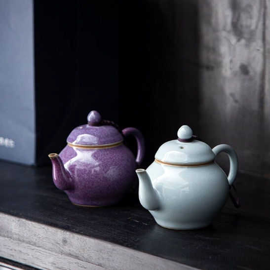 side view of 100ml small ceramic teapot with infuser