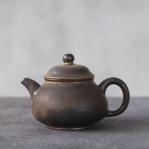 full side view of 100ml rustic Chinese ceramic teapot with infuser