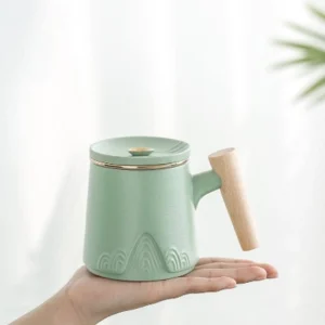 Full 10oz ceramic tea infuser mug with wood handle and mountain relief pattern