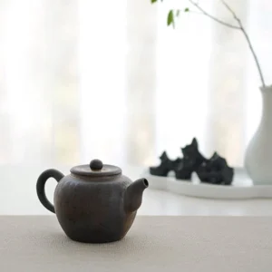 full side view of 110ml antique ceramic teapot with infuser