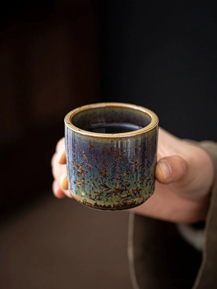 holding 120ml crystalline glaze chinese tea cup in hand