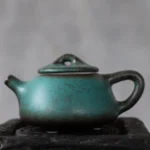 125ml vintage turquoise ceramic teapot with infuser full side view