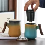 main product view of 14oz ceramic tea infuser mug with wooden handle