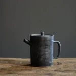 full side view of 150ml vintage black ceramic teapot with infuser