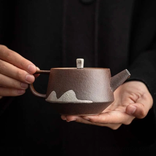 front view of 180ml faraway mountain ceramic teapot with infuser