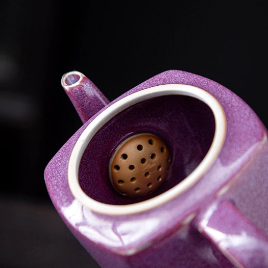 close up of built-in infuser strainer inside 180ml square purple teapot