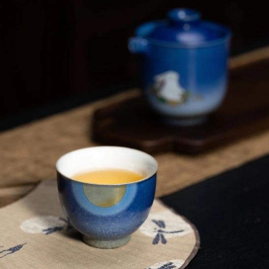 Side view of 180ml gradient blue ceramic travel tea set teapot