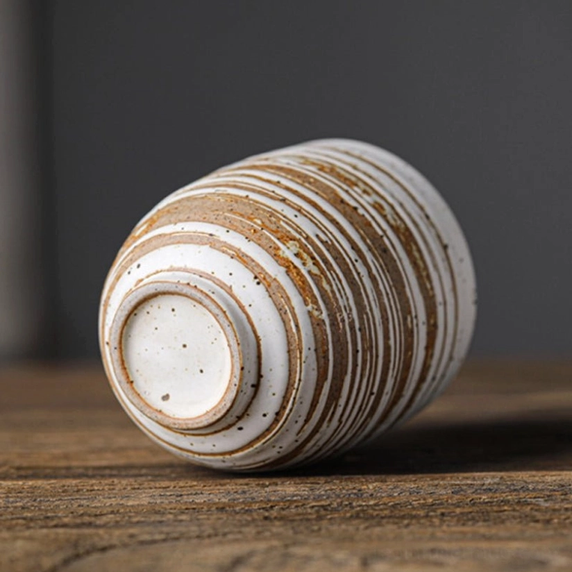 size comparison of 200ml vintage Chinese clay tea cup next to a teapot