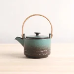 200ml gradient green ceramic teapot with wooden handle and metal infuser main view