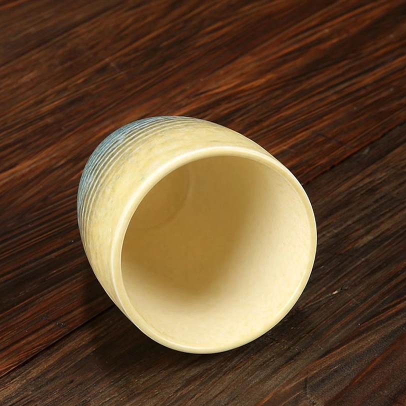200ml japanese tea cup held in hand showing size