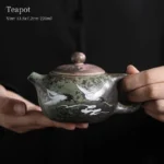 full side view of 220ml crane pattern ceramic teapot with infuser