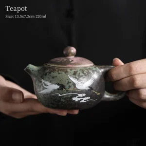 full side view of 220ml crane pattern ceramic teapot with infuser