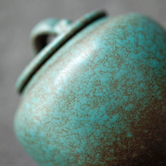 300ml airtight ceramic tea canister on natural woven mat