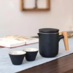 full open view of 300ml ceramic travel tea set with teapot and two teacups