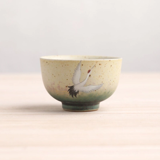 Style A yellow speckled ceramic Chinese tea cup with hand-painted motif