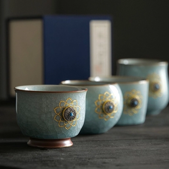 all four styles of chinese ru kiln lotus ceramic tea cups displayed together