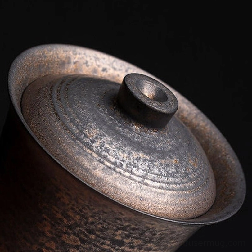 Close up of bronze glaze texture on Chinese gaiwan tea cup