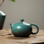 full side view 250ml antique green ceramic teapot with infuser