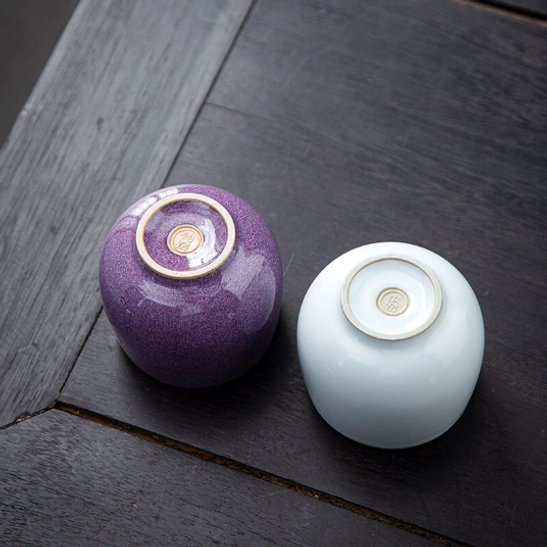 bottom base view of purple antique porcelain tea cup showing decorative mark