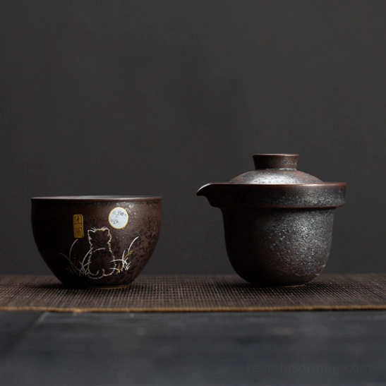 Gaiwan teapot and matching cup arranged for use for travel tea set