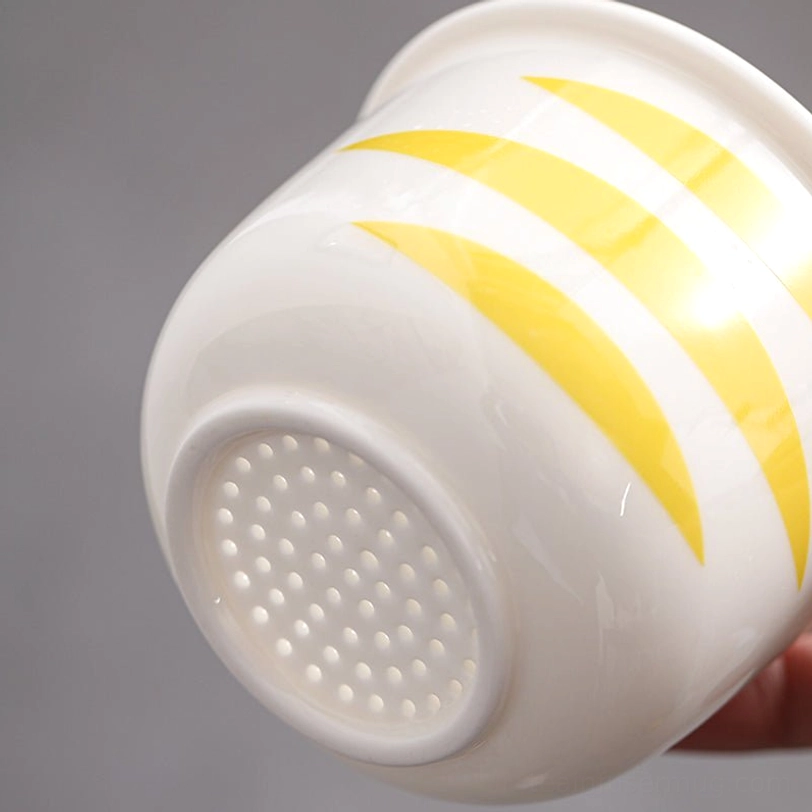 assembled cat glass tea infuser mug sitting on natural wood coaster