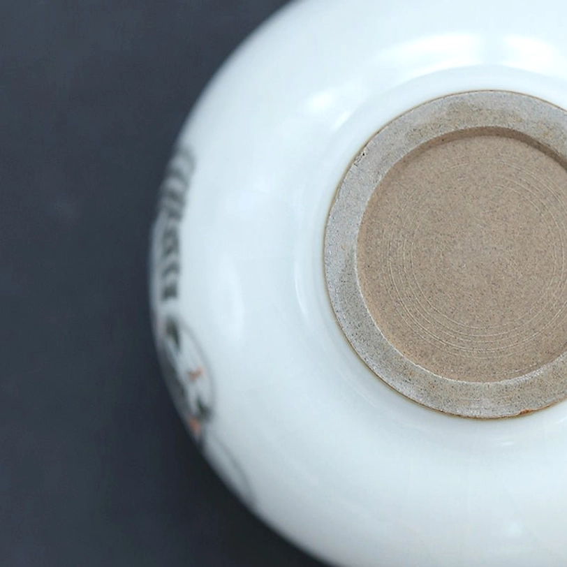 bottom base view of cat ceramic chinese tea cup showing raw clay