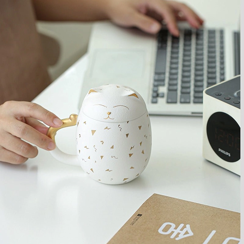 black and white lucky cat tea infuser mugs displayed side by side