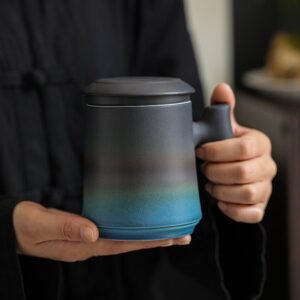 black blue gradient ceramic tea mug with strainer and wood handle front view