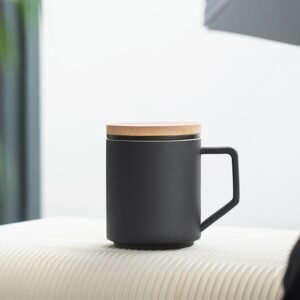 matte black ceramic tea infuser mug with natural wooden lid front view