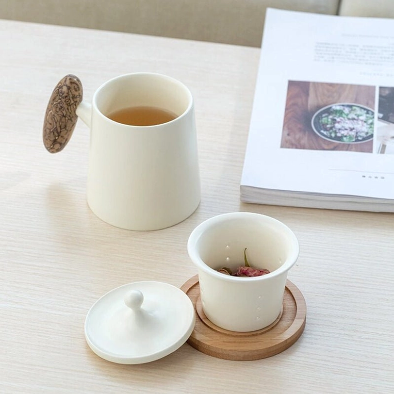 black ceramic tea infuser mug with removed ceramic filter infuser