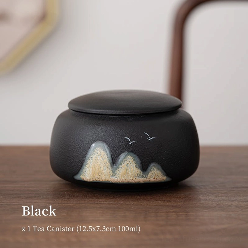 black ceramic tea storage canister with landscape pattern