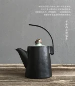 side view 250ml black ceramic teapot with metal handle and natural stone lid knob