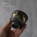 style a black clay golden crane chinese tea cup side view