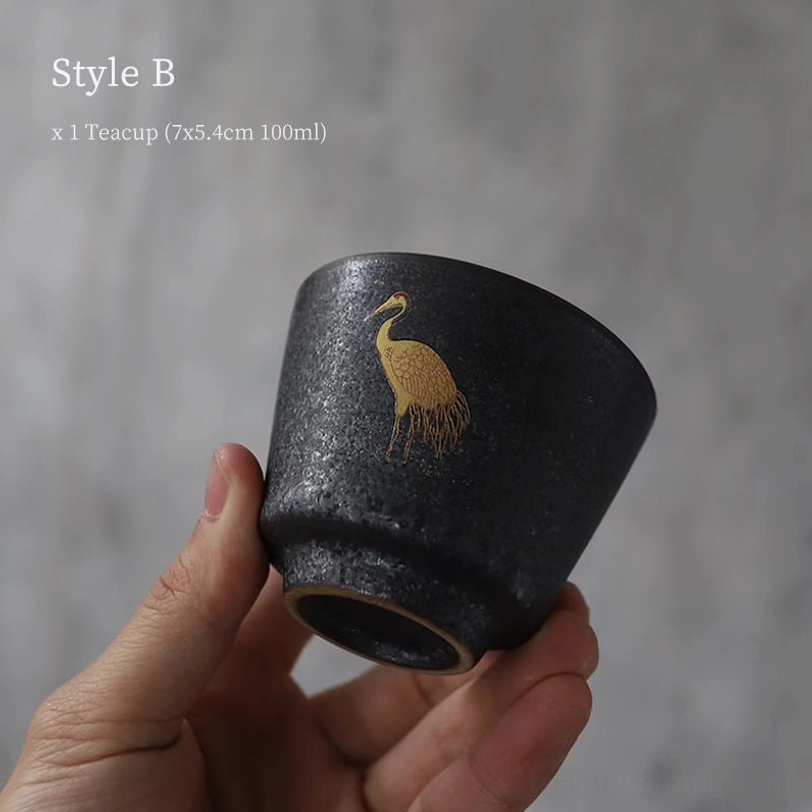 style b black clay golden crane chinese tea cup on wooden background