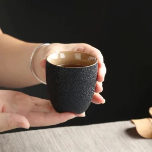 black clay 150ml ceramic tea cup side view textured exterior