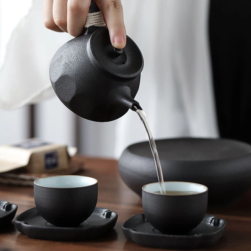 close up of tea cup interior from black clay tea set