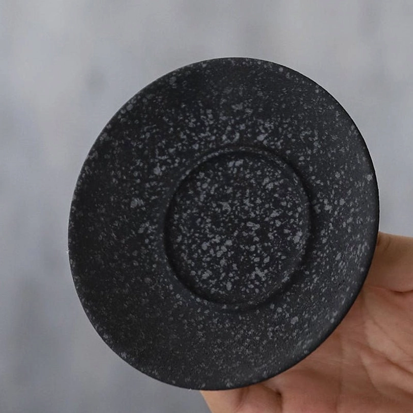 close up of textured speckled exterior of black 150ml gaiwan tea cup