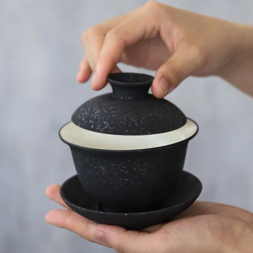 view of smooth white interior glaze of 150ml black gaiwan tea cup bowl