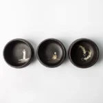 matte black japanese ceramic tea cup full exterior view
