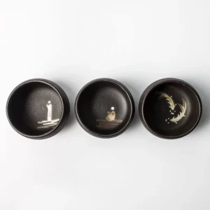 matte black japanese ceramic tea cup full exterior view