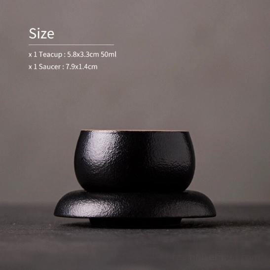 Black Japanese tea cup and saucer set from a slight diagonal angle