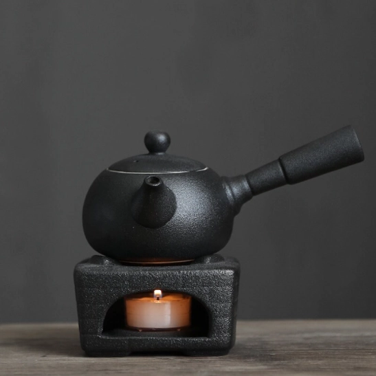 black kyusu teapot with infuser side handle close up