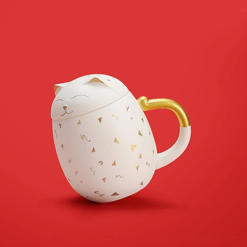 side view of black lucky cat tea infuser mug with gold detailing