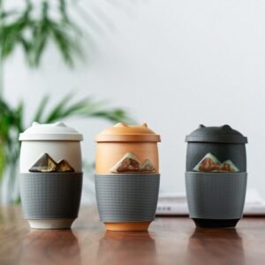 black ceramic mountain tea mug with infuser lid and silicone grip