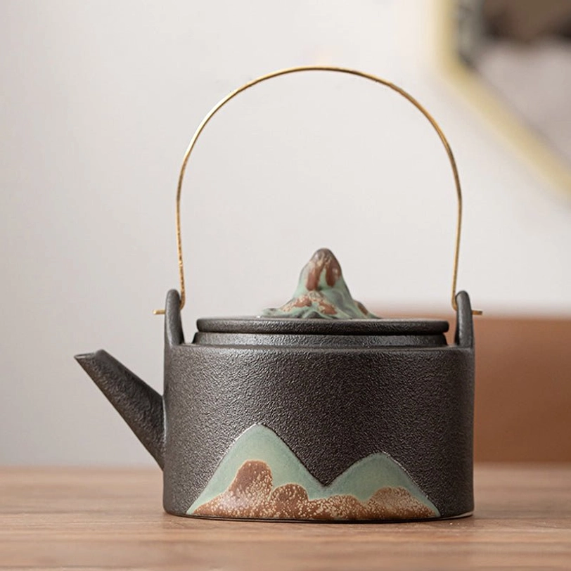 black mountain ceramic teapot with infuser close up of mountain pattern