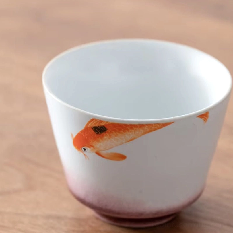 black chinese porcelain tea cup with golden crane auspicious design