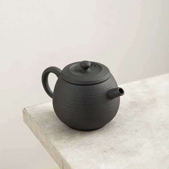 Black textured volcanic rock clay teapot with side handle