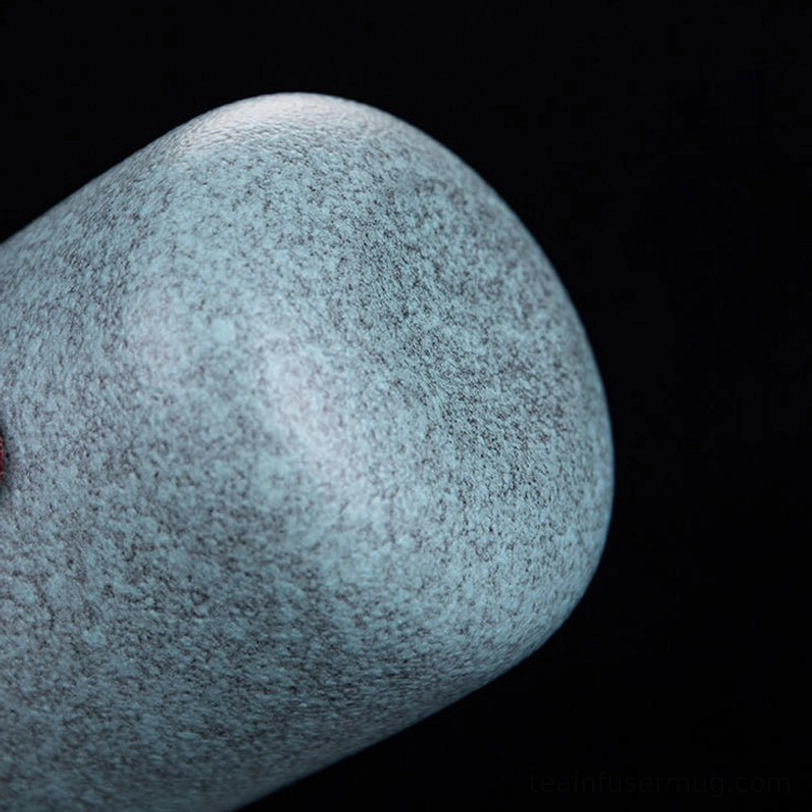 black travel tea set teapot pouring clear brewed tea