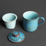 full view blue gold speckled ceramic tea mug with infuser lid