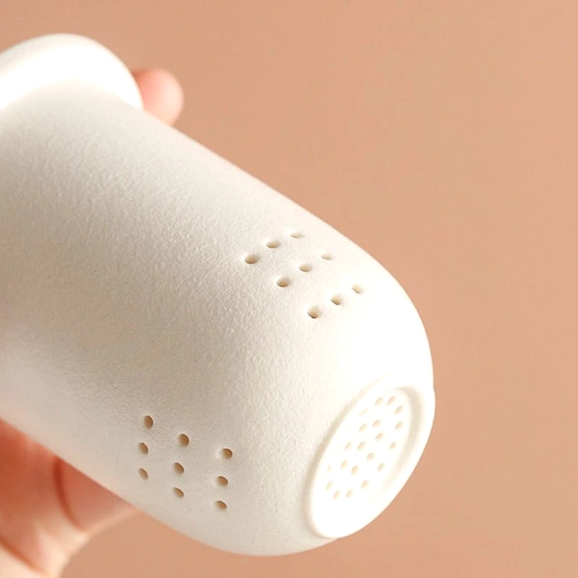 side view of ribbed blue gradient glass tea infuser mug with ceramic lid